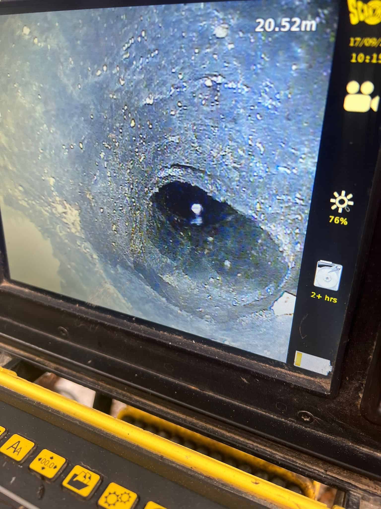 Close-up of pitch fibre drain pipe repair with camera inspection. CCTV drain survey in reading | pitch fibre pipe repair