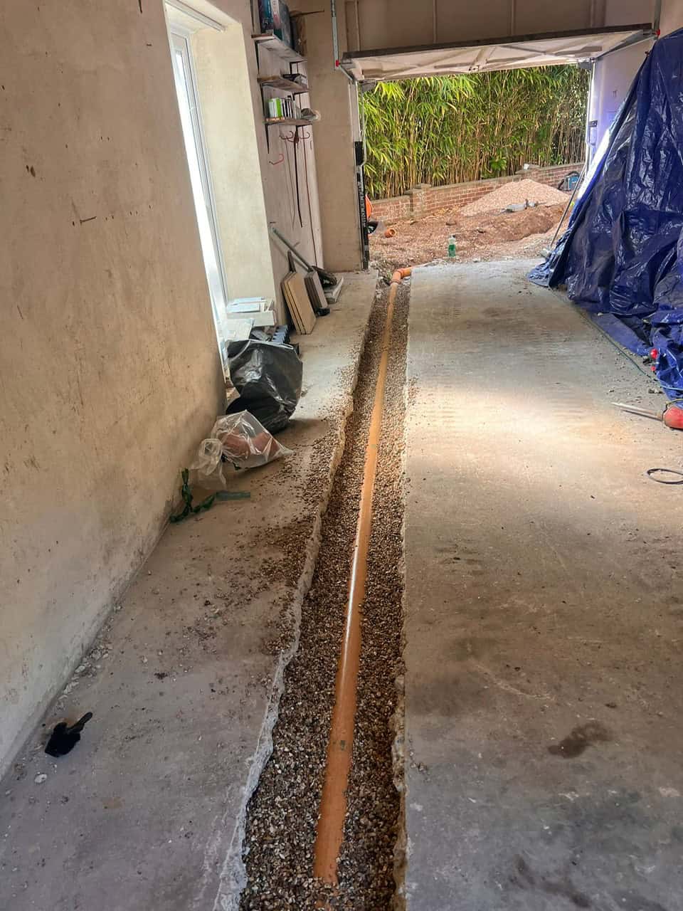 Drain installation and excavation process for effective drainage solutions.