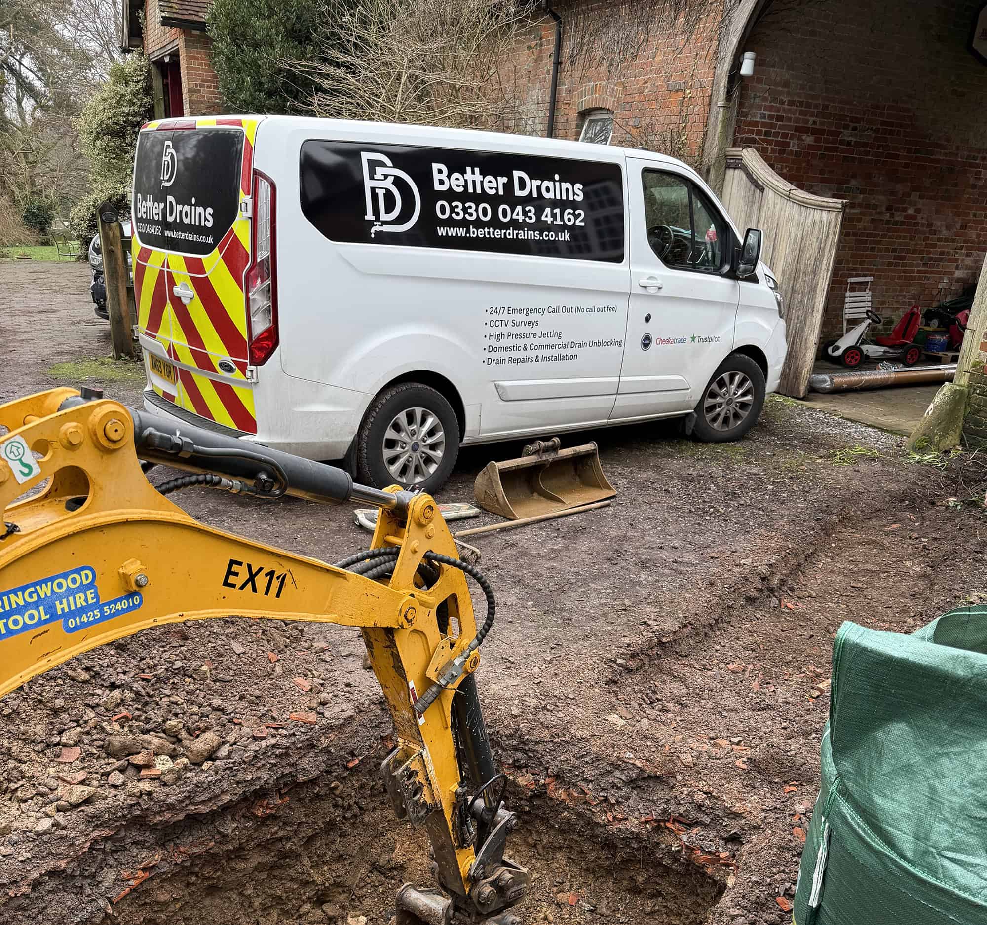 Better Drains van providing drainage services at a construction site. professional drainage services